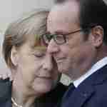 French President Francois Hollande embraces German Chancellor Angela Merkel, left, as she arrives at the Elysee Palace, Paris, Sunday, Jan. 11, 2015. A rally of defiance and sorrow, protected by an unparalleled level of security, on Sunday will honor the 17 victims of three days of bloodshed in Paris that left France on alert for more violence. (AP Photo/Thibault Camus)